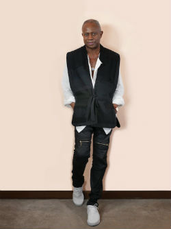 David Sancious in a vest standing